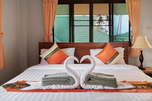 Postel nebo postele na pokoji v ubytování Samui Reef View Resort