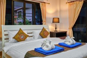 Postel nebo postele na pokoji v ubytování Samui Reef View Resort + 31 fotografií
