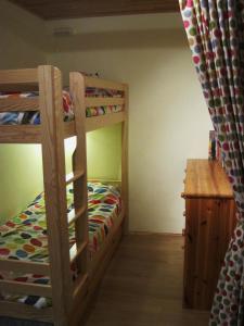 a bedroom with two bunk beds and a desk at Apartment Super Venosc in Les Deux Alpes