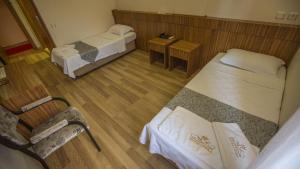 an overhead view of a room with two beds and a table at Hotel Cenka Ephesus in Selçuk