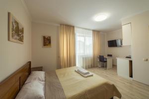 A bed or beds in a room at Villa ZHANNA Central park