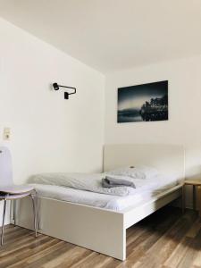 מיטה או מיטות בחדר ב-Zentrales Studio im Kaiserviertel