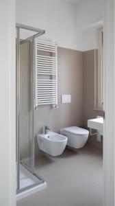 a bathroom with a shower and a toilet and a sink at MaisonMe in Vasto +32 photos