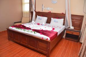 מיטה או מיטות בחדר ב-Pavilion Holiday Resort