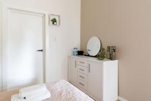 Posteľ alebo postele v izbe v ubytovaní Apartament Miły