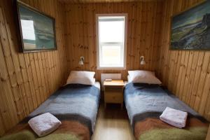 Postel nebo postele na pokoji v ubytování Eldhraun Holiday Home
