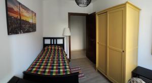 A bed or beds in a room at Alle Porte di Genova