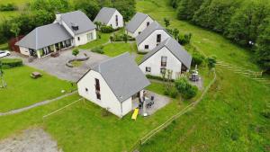 an aerial view of a house with a yard at Cottage 4 étoiles en Auvergne - Cantal Emotions Valette - Auvergne in Valette