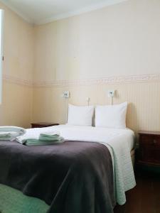Cama ou camas em um quarto em Guesthouse Casa Pombal