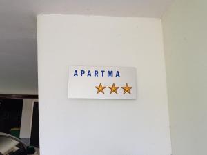 a sign on a wall that says aprilmite at Apartma Take It Easy in Bled