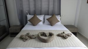 Postel nebo postele na pokoji v ubytování Hotel Plein Soleil