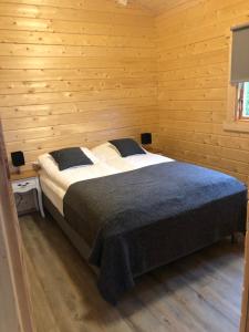 מיטה או מיטות בחדר ב-Miðsker 1