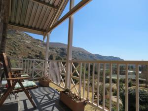 a balcony with a view of the mountains at Fairview Cottages in Clarens