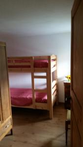 a bedroom with two bunk beds in a room at CA' AURONIA in Baceno