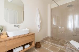 a bathroom with a sink and a mirror at Palazzo Mulini in Monopoli