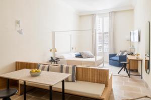 a living room with a couch and a table at Palazzo Mulini in Monopoli