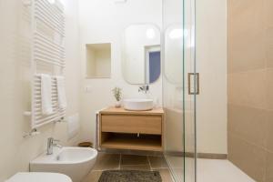 a bathroom with a sink and a mirror at Palazzo Mulini in Monopoli