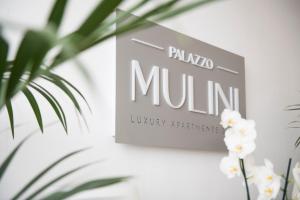 a sign that reads palaio muna luxury furniture at Palazzo Mulini in Monopoli