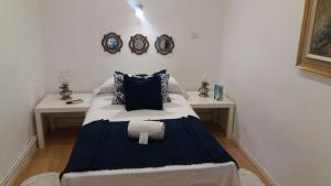 A bed or beds in a room at Casa de Huéspedes Prada