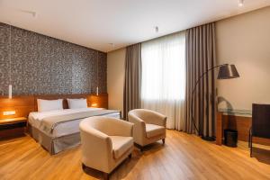 Hotel Tbilisi Tower客房内的一张或多张床位