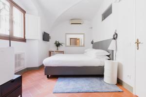 Ένα ή περισσότερα κρεβάτια σε δωμάτιο στο The Artists' Palace Florence