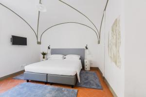 Ένα ή περισσότερα κρεβάτια σε δωμάτιο στο The Artists' Palace Florence