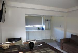 a living room with a couch and a window at Carabelli Propiedades II in Río Grande