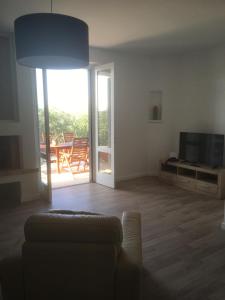 a living room with a couch and a television at Galeb in Vodice