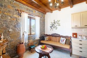 a living room with a couch and a table at Villa Maria in Stavrokhórion