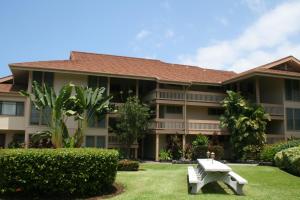 a building with a bench in front of it at Sea Village 2nd floor Direct Oceanfront unit with extensive upgrades in Kailua-Kona