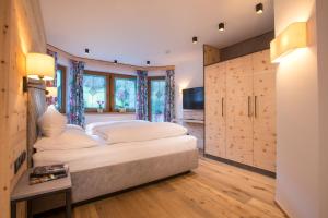 Voodi või voodid majutusasutuse Hotel Tipotsch toas