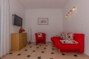 Televízia a/alebo spoločenská miestnosť v ubytovaní Villa Marija Apartments
