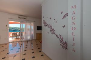Televízia a/alebo spoločenská miestnosť v ubytovaní Villa Marija Apartments