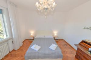 En eller flere senger på et rom på Appartamento Lido Mare