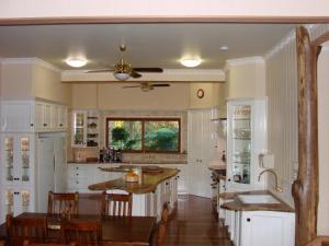 a kitchen with a table and a dining room at Clarence River Bed & Breakfast in Grafton