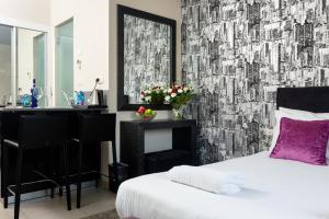 Ένα ή περισσότερα κρεβάτια σε δωμάτιο στο Hillel 11 Hotel