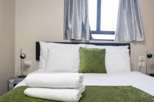 Ένα ή περισσότερα κρεβάτια σε δωμάτιο στο Hillel 11 Hotel