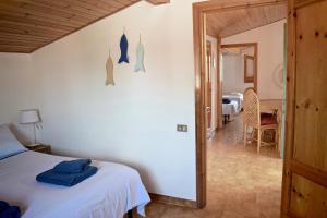 Postel nebo postele na pokoji v ubytování Bedda Casa Al Mare