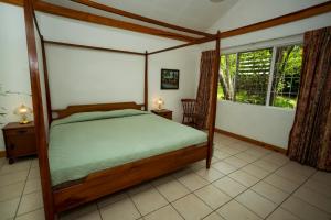 Casa de Piedra Escazúにあるベッド