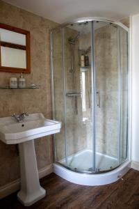 a bathroom with a shower and a sink at West Cottage, Cerne Abbas Lane in Dorchester +23 photos