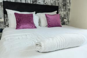 Ένα ή περισσότερα κρεβάτια σε δωμάτιο στο Hillel 11 Hotel