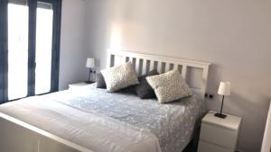 A bed or beds in a room at Apartamento Jazmín