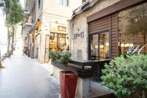 a storefront of a store on a city street at Hillel 11 Hotel in Jerusalem