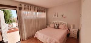 A bed or beds in a room at Paulalucía Még 23 kép