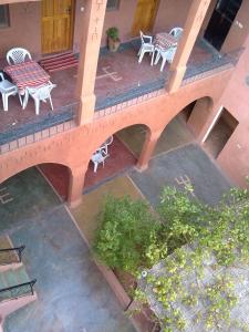an overhead view of a bridge with chairs and tables at Auberge Des Jardins du Dades in Boumalne