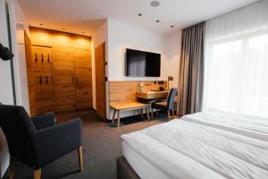TV a/nebo společenská místnost v ubytování Hotel Tannenhaus