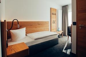 Postel nebo postele na pokoji v ubytování Hotel Tannenhaus