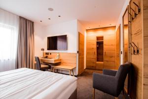 TV a/nebo společenská místnost v ubytování Hotel Tannenhaus