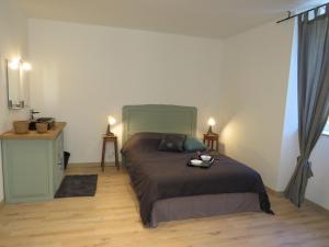 Ένα ή περισσότερα κρεβάτια σε δωμάτιο στο Gite du verger