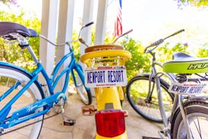 two bikes parked on a porch with signs on them at Newport Resort in Egg Harbor